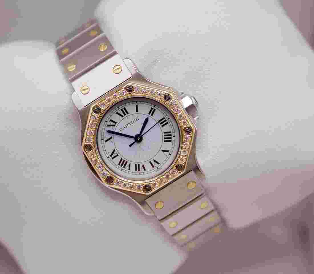 Cartier Santos
Octagon 25mm Custom Diamond Bezel White Dial Two Tone 18kt Gold Watch