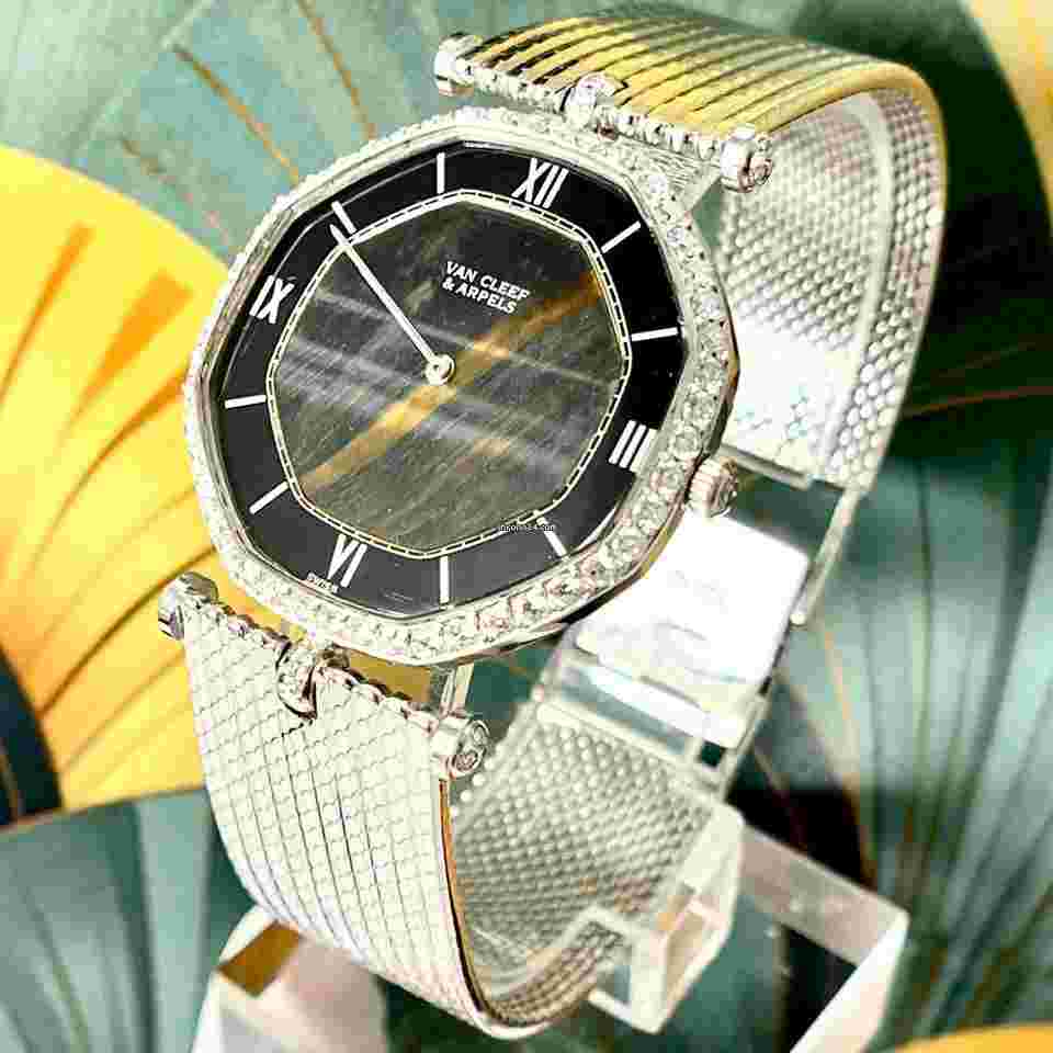 Van Cleef & Arpels
                           
                                 Vintage 18K White Gold Tiger's Eye Quartz Dial and Diamond Bezel Automatic VCA