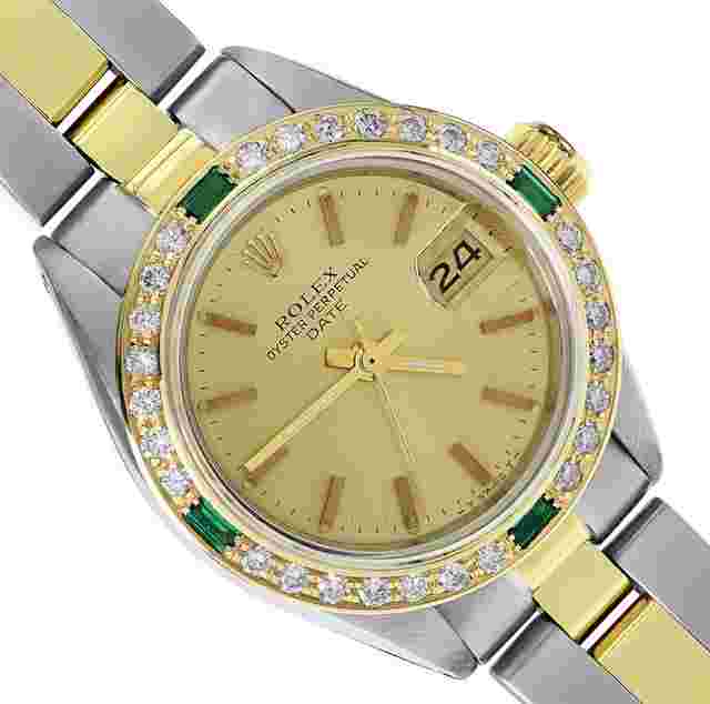Rolex Oyster Perpetual Lady Date
                           
                                 Ladies Two Tone Date 26MM Champagne Index Dial 18K Yellow Gold Diamond Emerald Bezel Watch