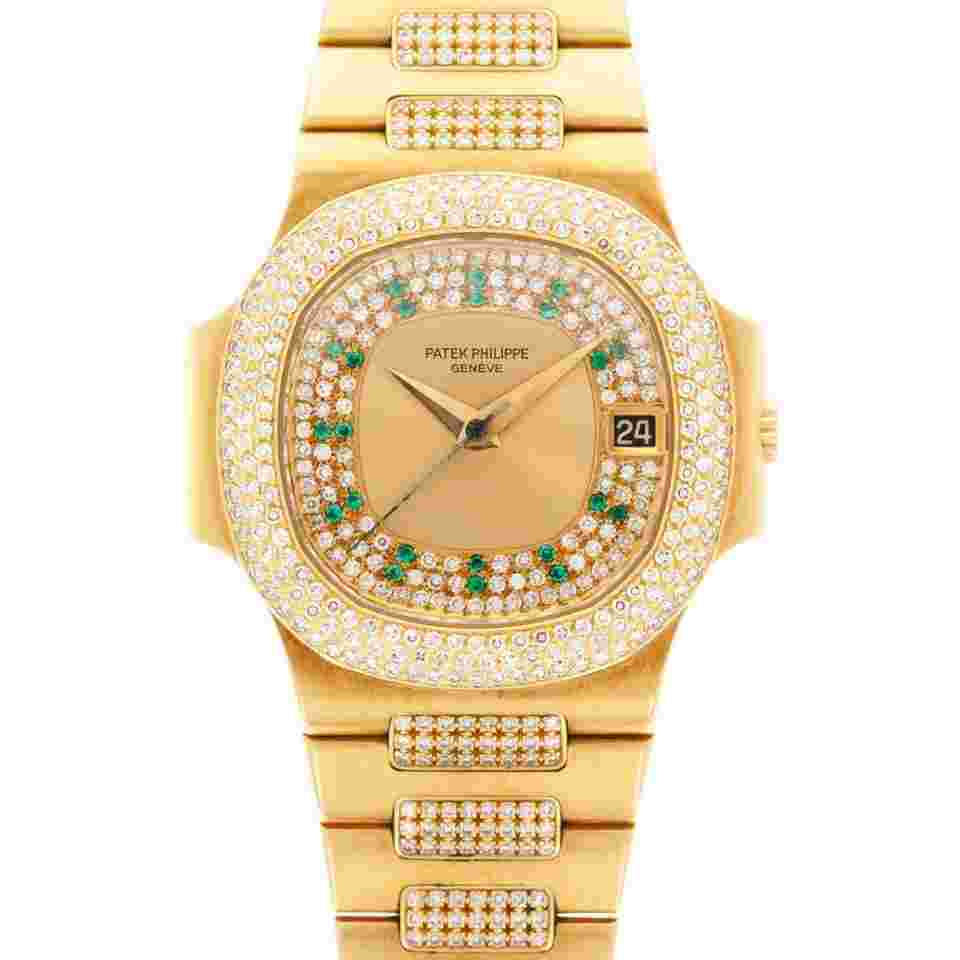 Patek Philippe Nautilus
Yellow Gold Nautilus Ref. 3800/105 with Pave Diamond and Emerald