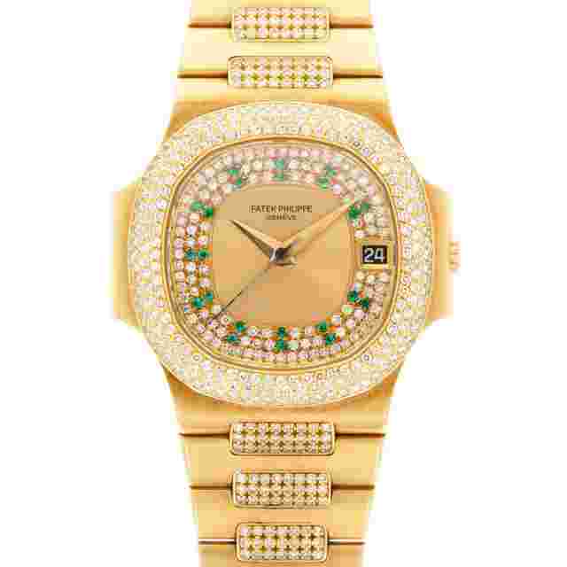 Patek Philippe Nautilus
                           
                                 Yellow Gold Nautilus Ref. 3800/105 with Pave Diamond and Emerald