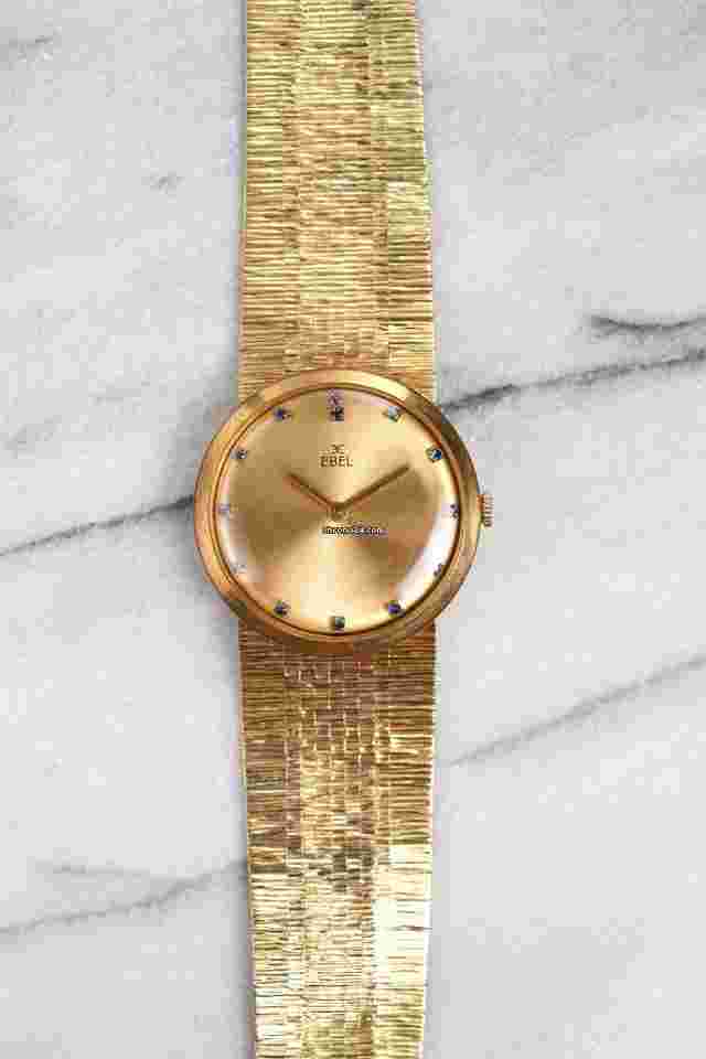 Ebel
                           
                                 Vintage 1970s 18K Yellow Gold Champagne Sapphire Dial Manual Wind 34mm Case