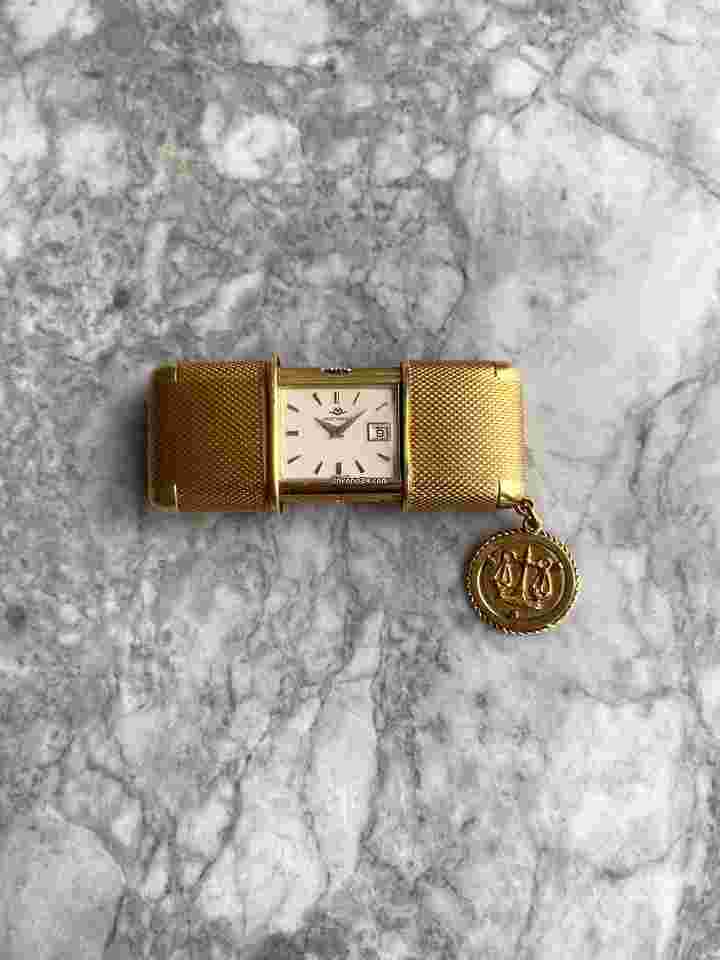Movado
Vintage 1950s 18K Gold Manual Wind Travel Clock.