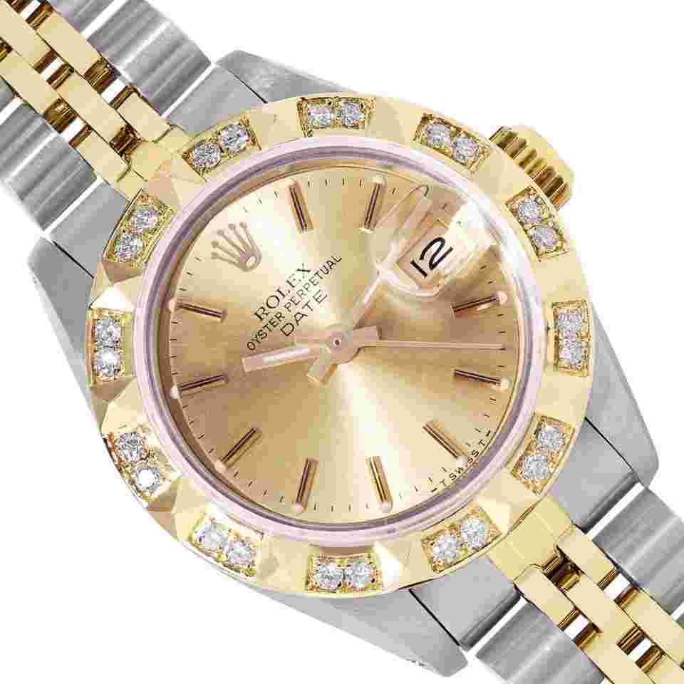 Rolex Oyster Perpetual Lady Date
Ladies Two Tone Date 26MM Champagne Index Dial 18K Yellow Gold Pyramid Diamond Bezel Watch