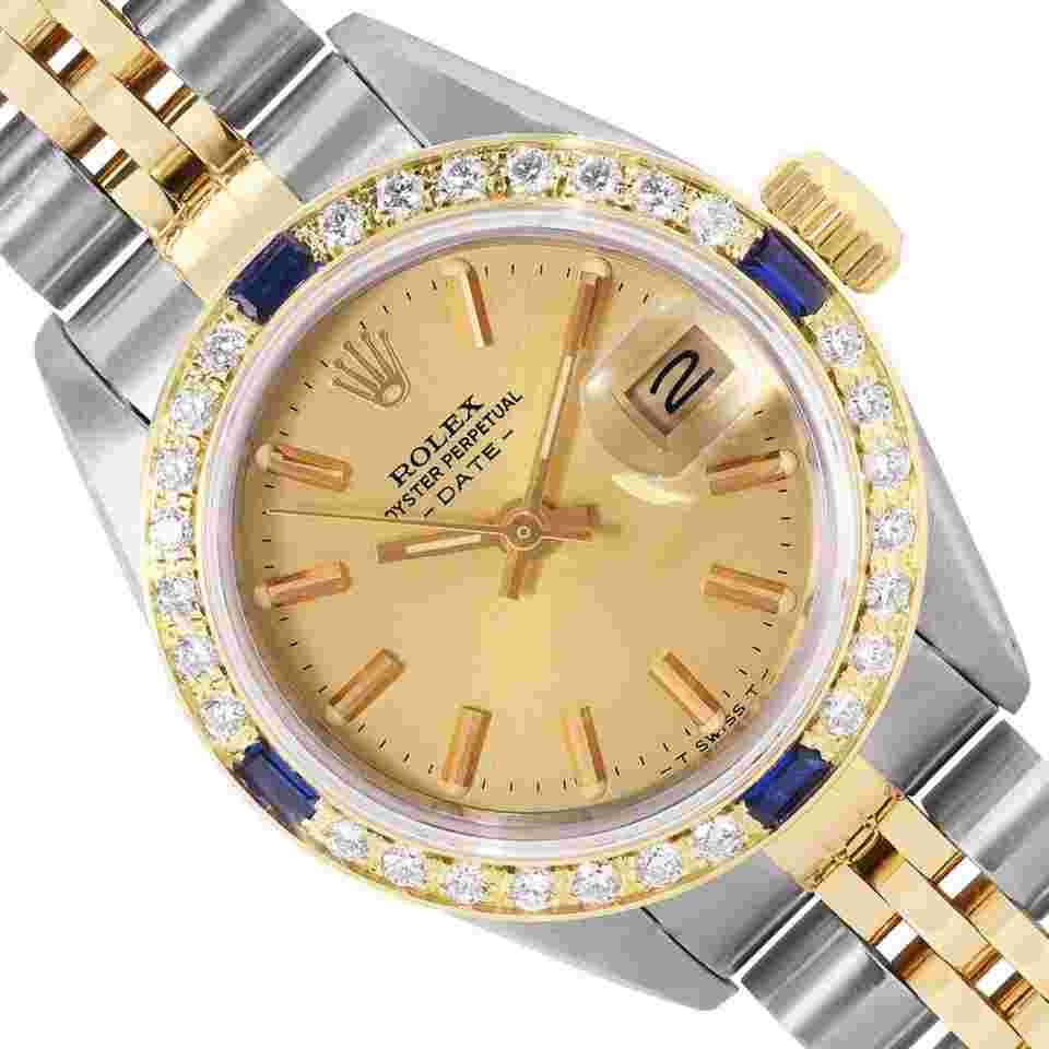 Rolex Oyster Perpetual Lady Date
Ladies Two Tone Date 26 Champagne Index Dial 18K Yellow Gold Diamond Sapphire Bezel Watch