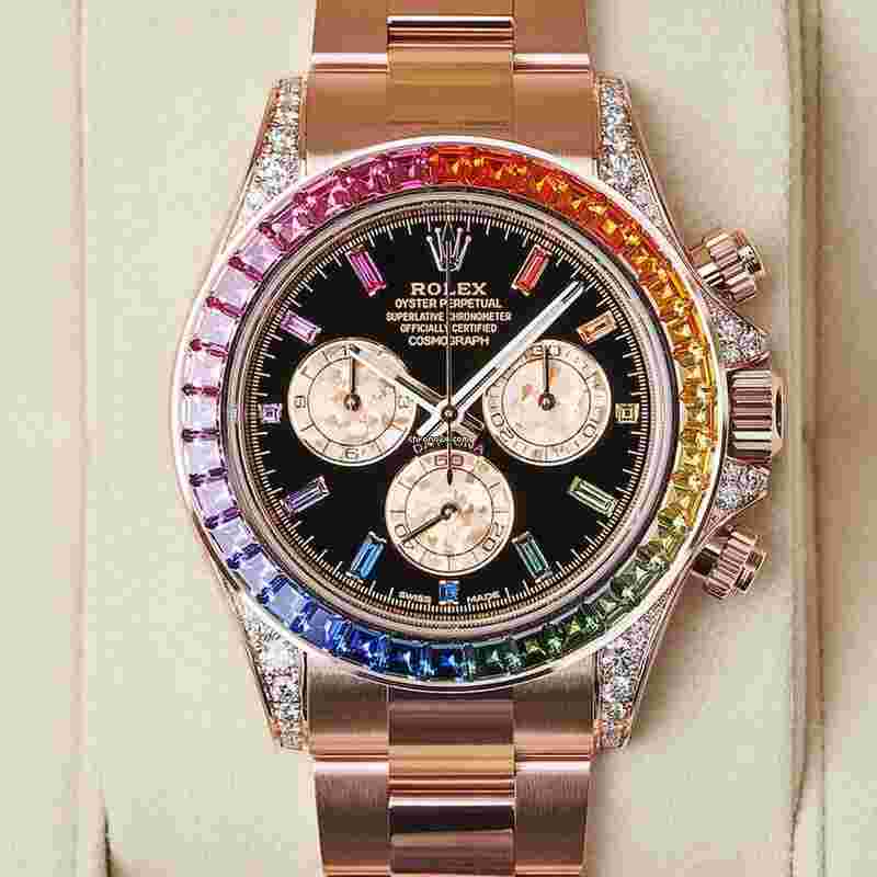 Rolex Daytona
Cosmograph Daytona 40mm Rainbow Sapphire Bezel Everose Gold Black Diamond Baguette Dial