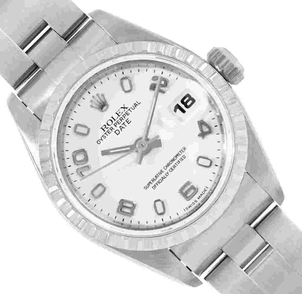 Rolex Oyster Perpetual Lady Date
Ladies Quickset Stainless Steel White Arabic Engine Turn Bezel Date Wristwatch 26MM