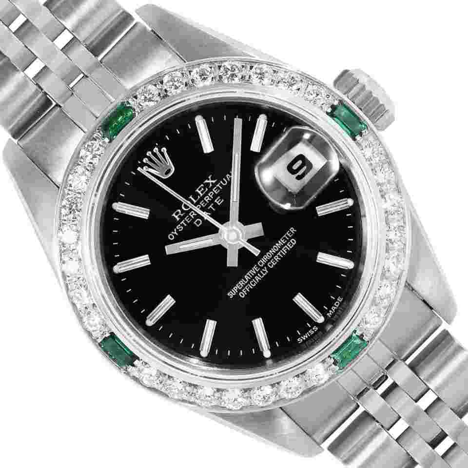 Rolex Oyster Perpetual Lady Date
Ladies Stainless Steel Black Index Dial Steel Diamond Emerald Bezel Date Wristwatch 26MM