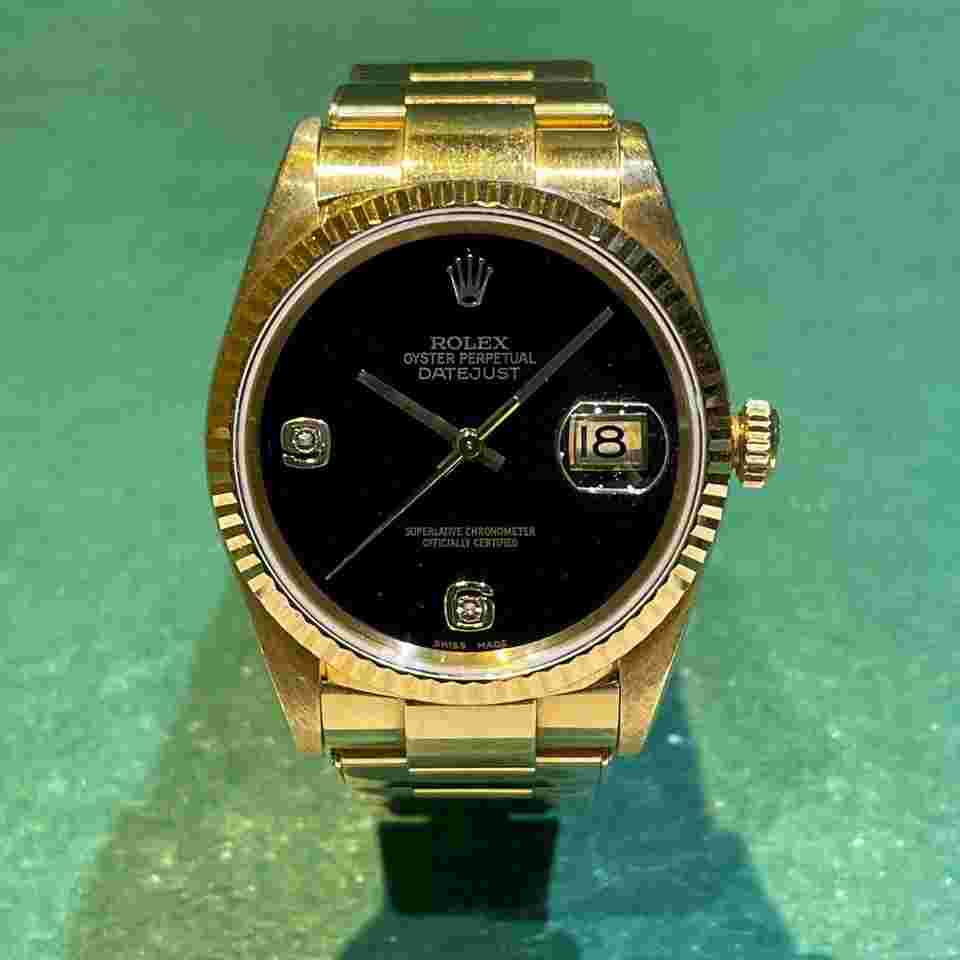 Rolex Datejust 36
16238 Oyster Perpetual 18k YG Datejust Onyx Dial with Rivet Band & Guarantee Paper